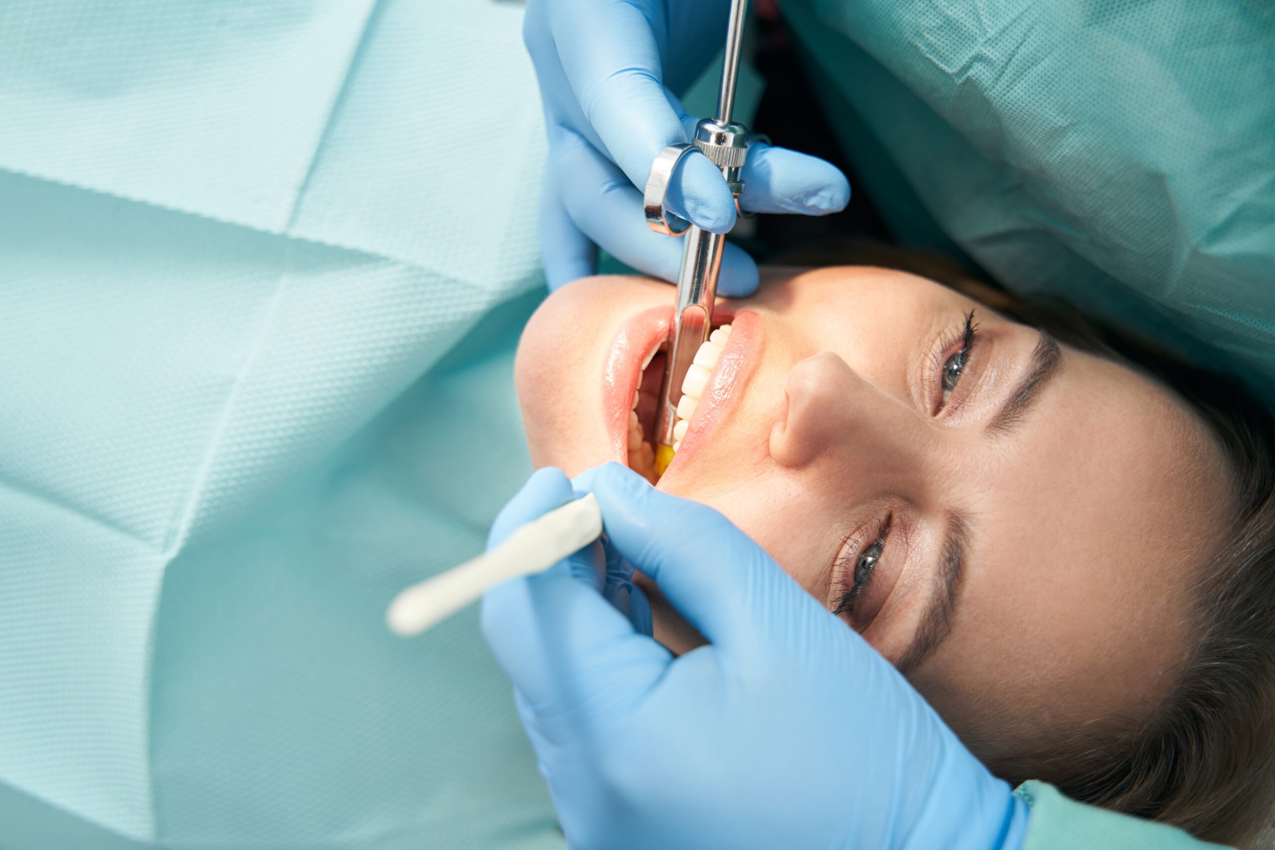 patient having a tooth removed in Alexandria