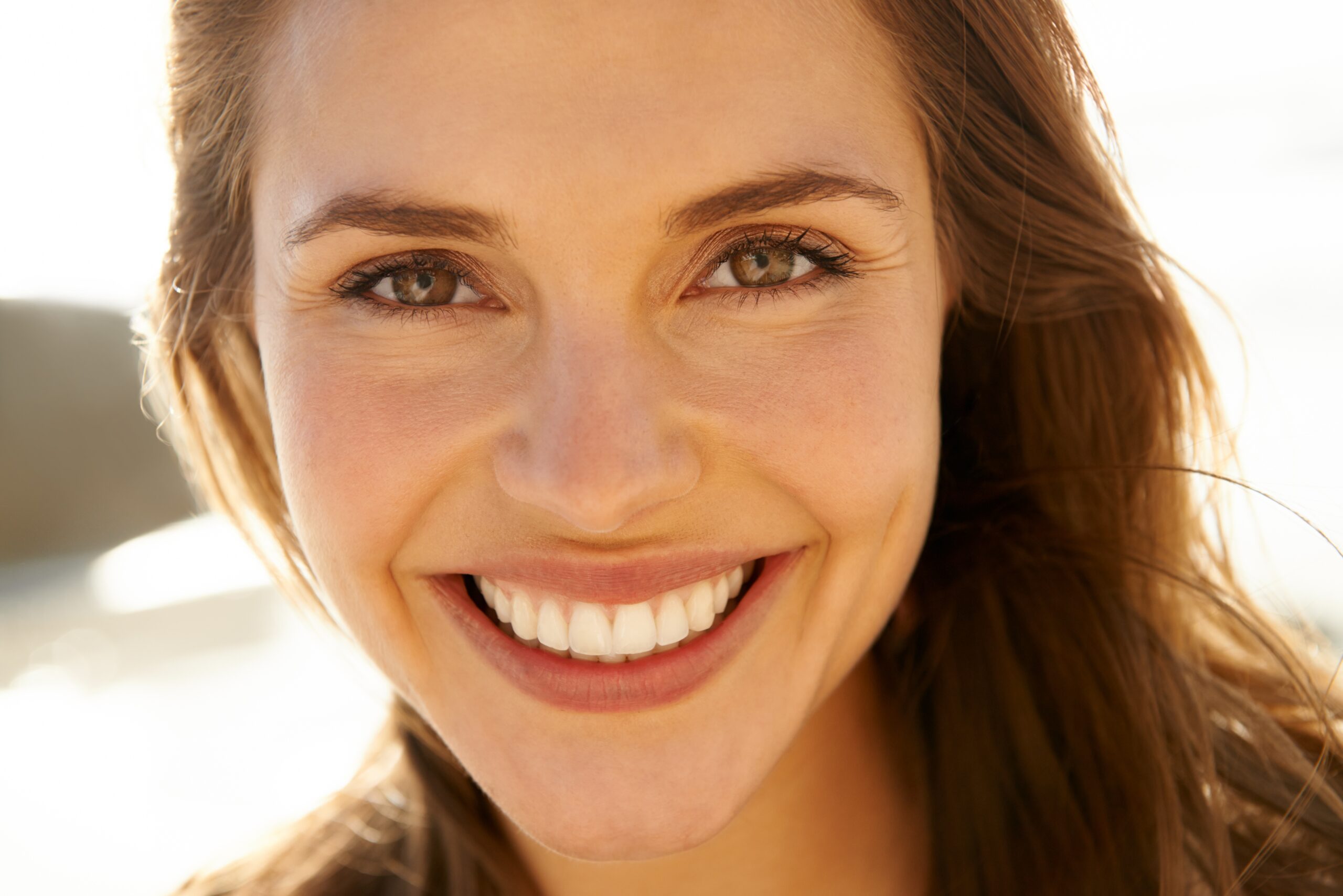 closeup of a woman showing her perfect smile